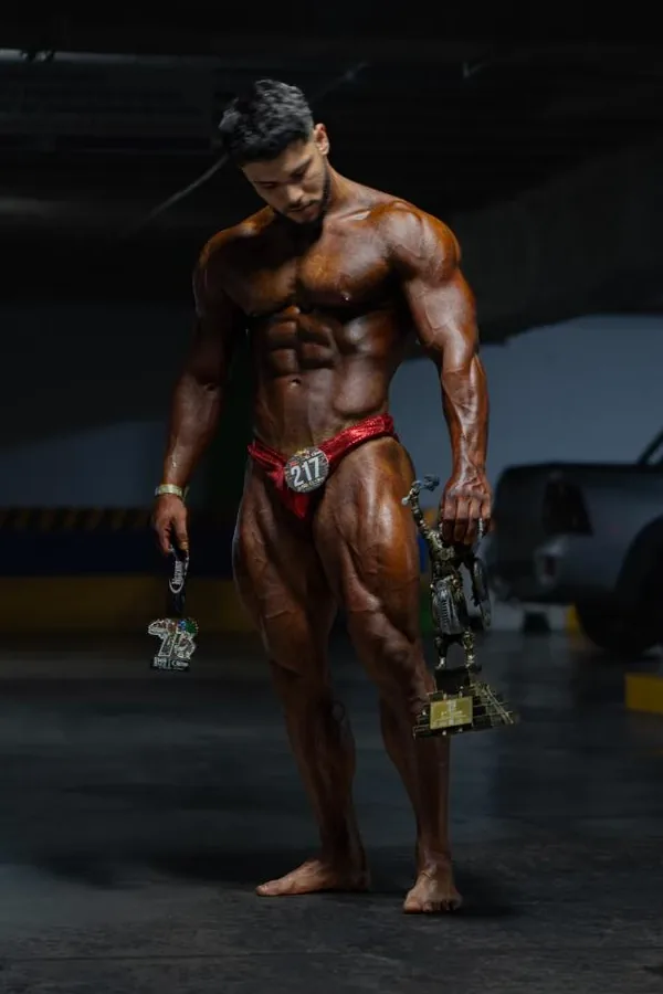 Kinetix athlete with his first-place trophy and medal