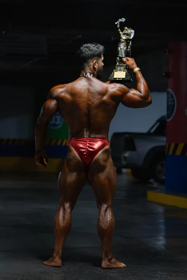 Kinetix athlete with his first-place trophy and medal