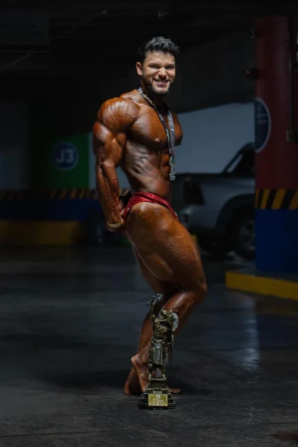 Kinetix athlete with his first-place trophy and medal