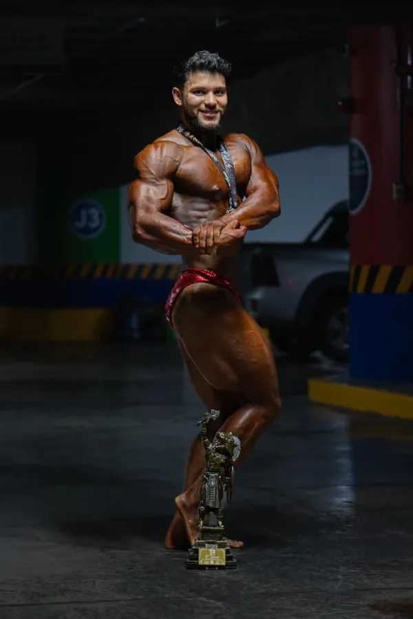 Kinetix athlete with his first-place trophy and medal